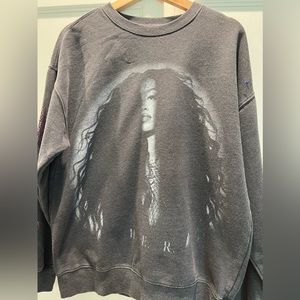 - H.E.R. Gray sweatshirt. Vintage like with rhinestones down the sleeves.